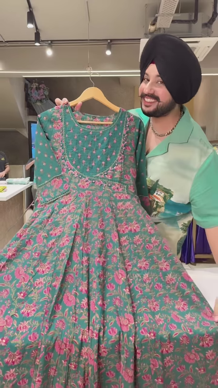 Green Floral Printed Ethnic Dress with Embroidered Neckline and Coordinated Fabric Panel - Image 3