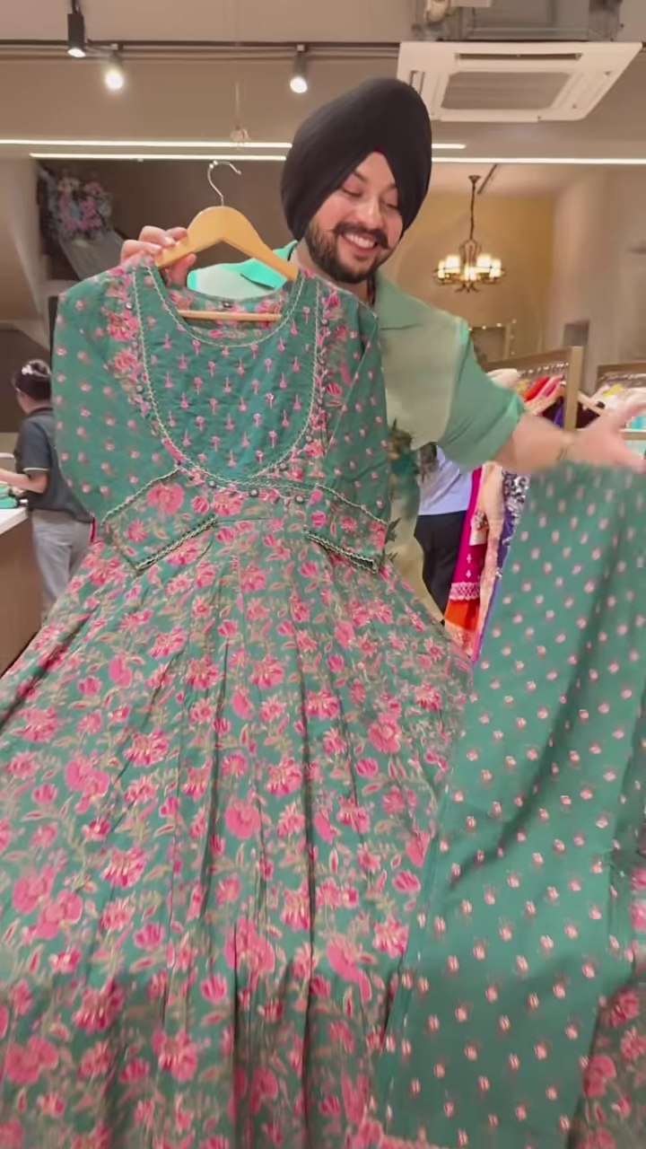 Green Floral Printed Ethnic Dress with Embroidered Neckline and Coordinated Fabric Panel - Image 2