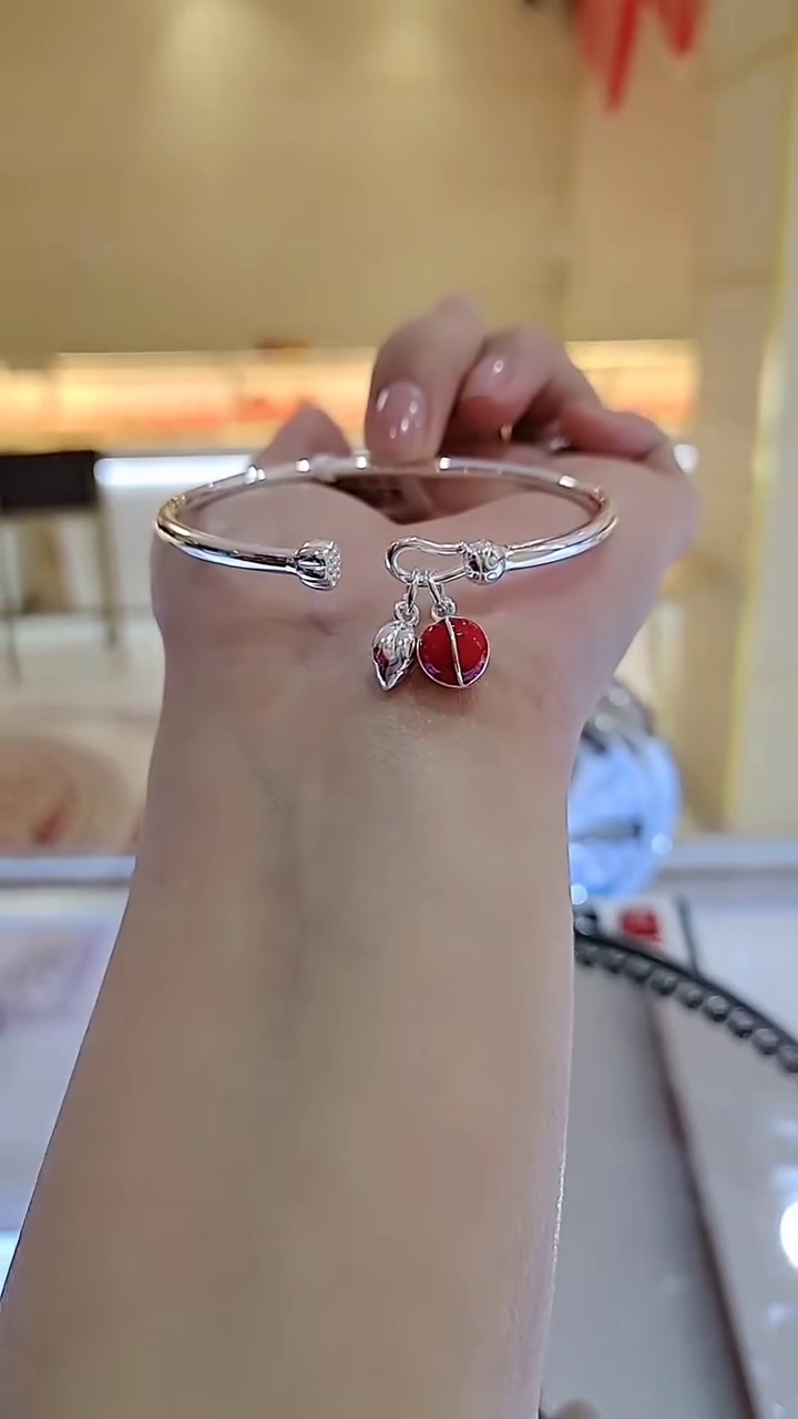 Charming Silver-Toned Bangle Bracelet with Enamel Ladybug and Leaf Charms