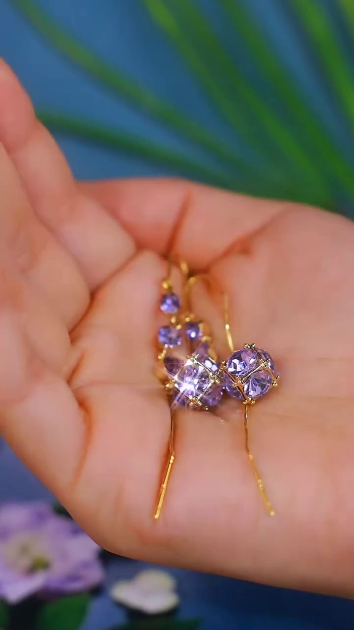 Elegant Gold-Toned Dangling Earrings with Purple Gemstone Clusters and Delicate Wirework - Image 2