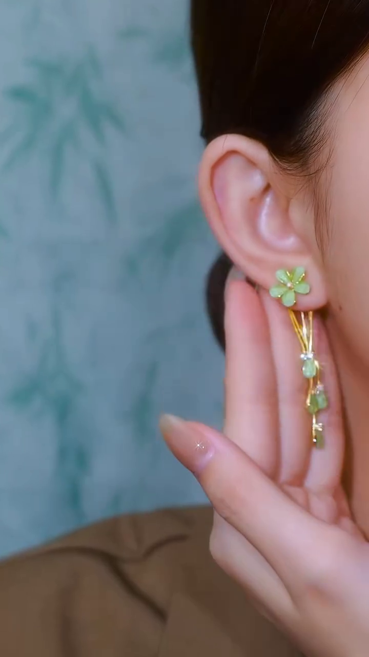 Whimsical Gold-Toned Flower Drop Earrings with Green Gemstone Accents and Delicate Chains - Image 2