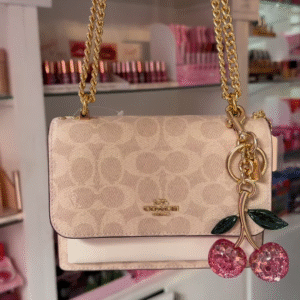 Elegant Designer Crossbody Bag with Signature Pattern and Chain Strap