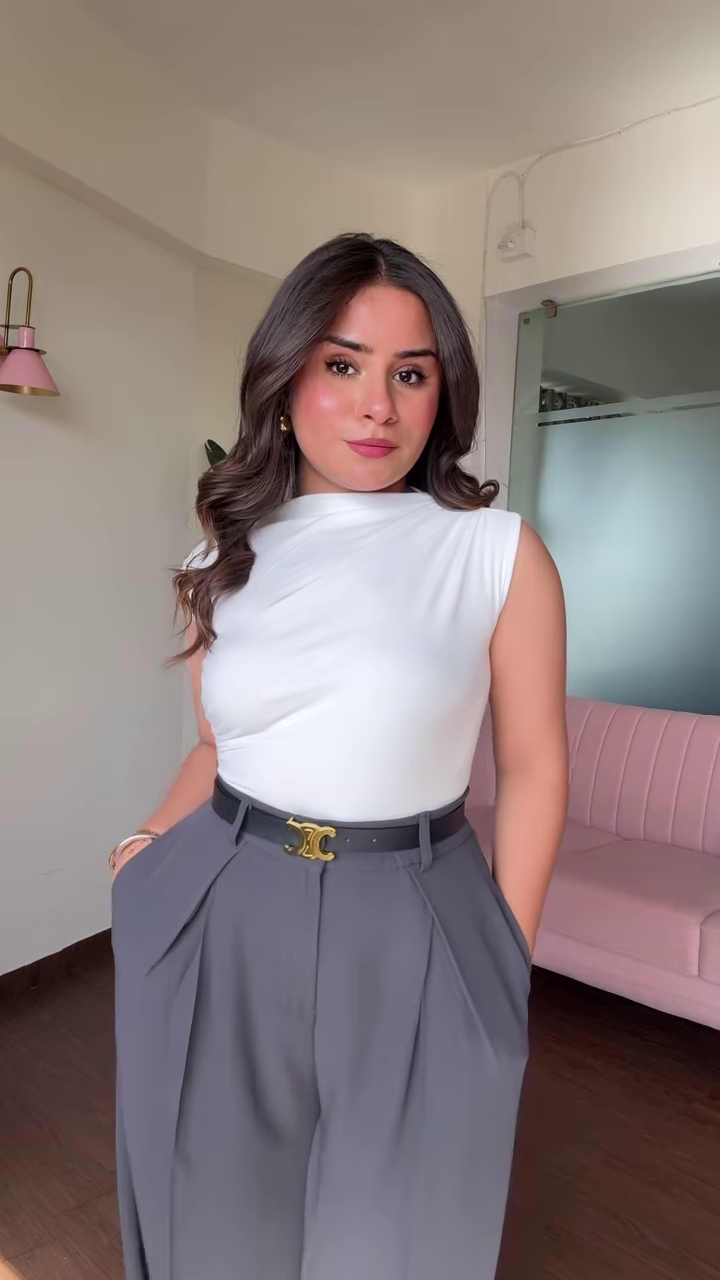 Chic Women's Outfit: Blue Mock Neck Long Sleeve Top and High-Waisted Black Wide-Leg Pants - Image 4