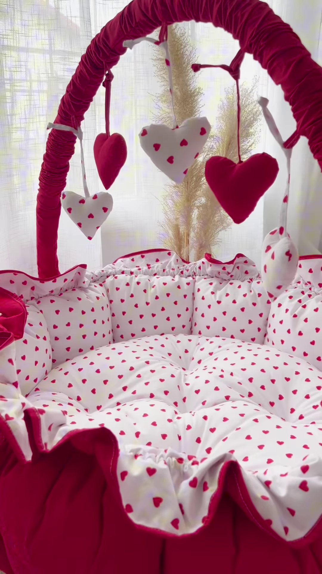 Cozy Baby Bassinet with Heart Print and Hanging Heart Mobiles