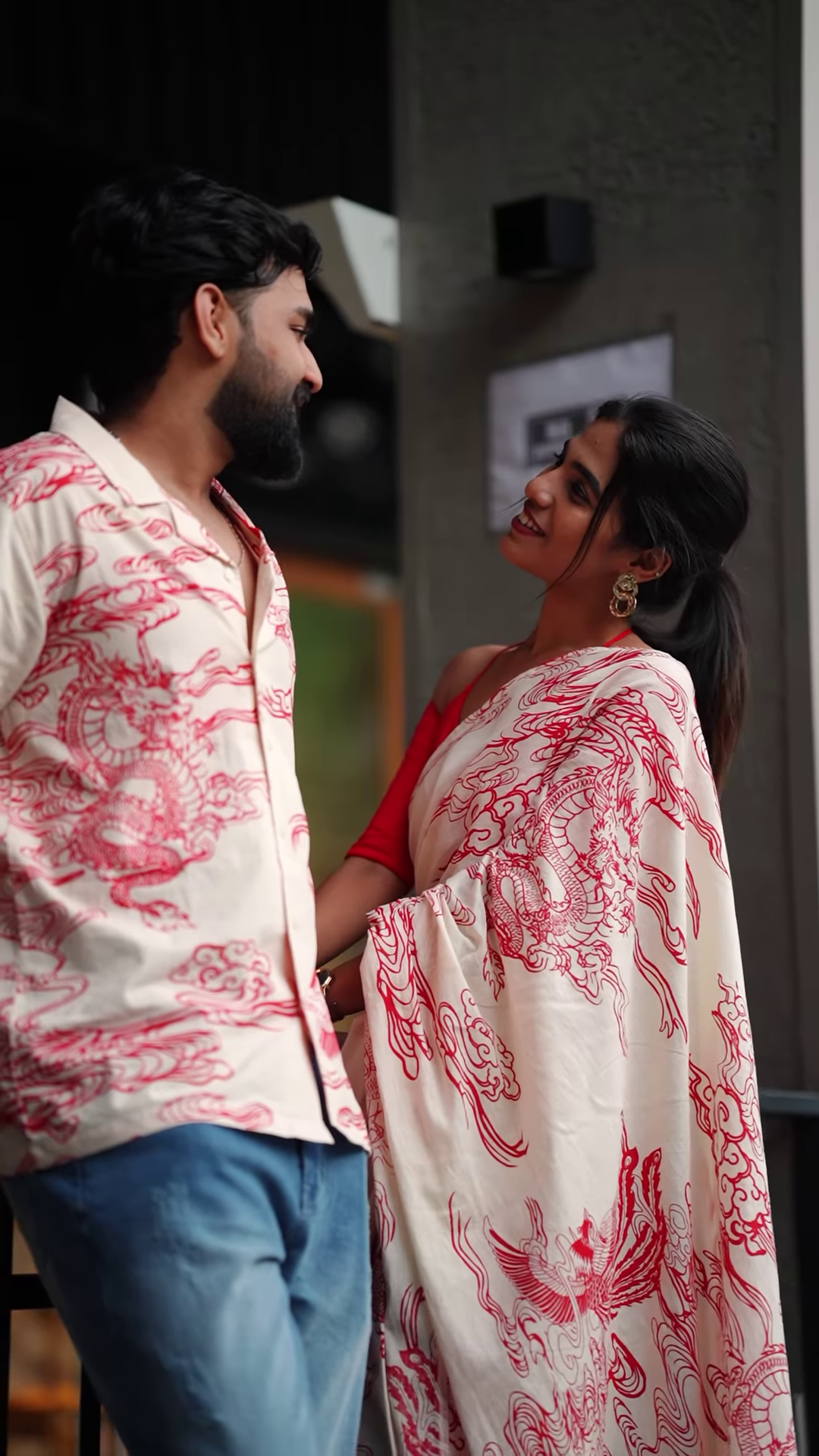 Couple’s Coordinated Ethnic Ensemble – White & Red Printed Saree with Matching Shirt and Jeans - Image 4