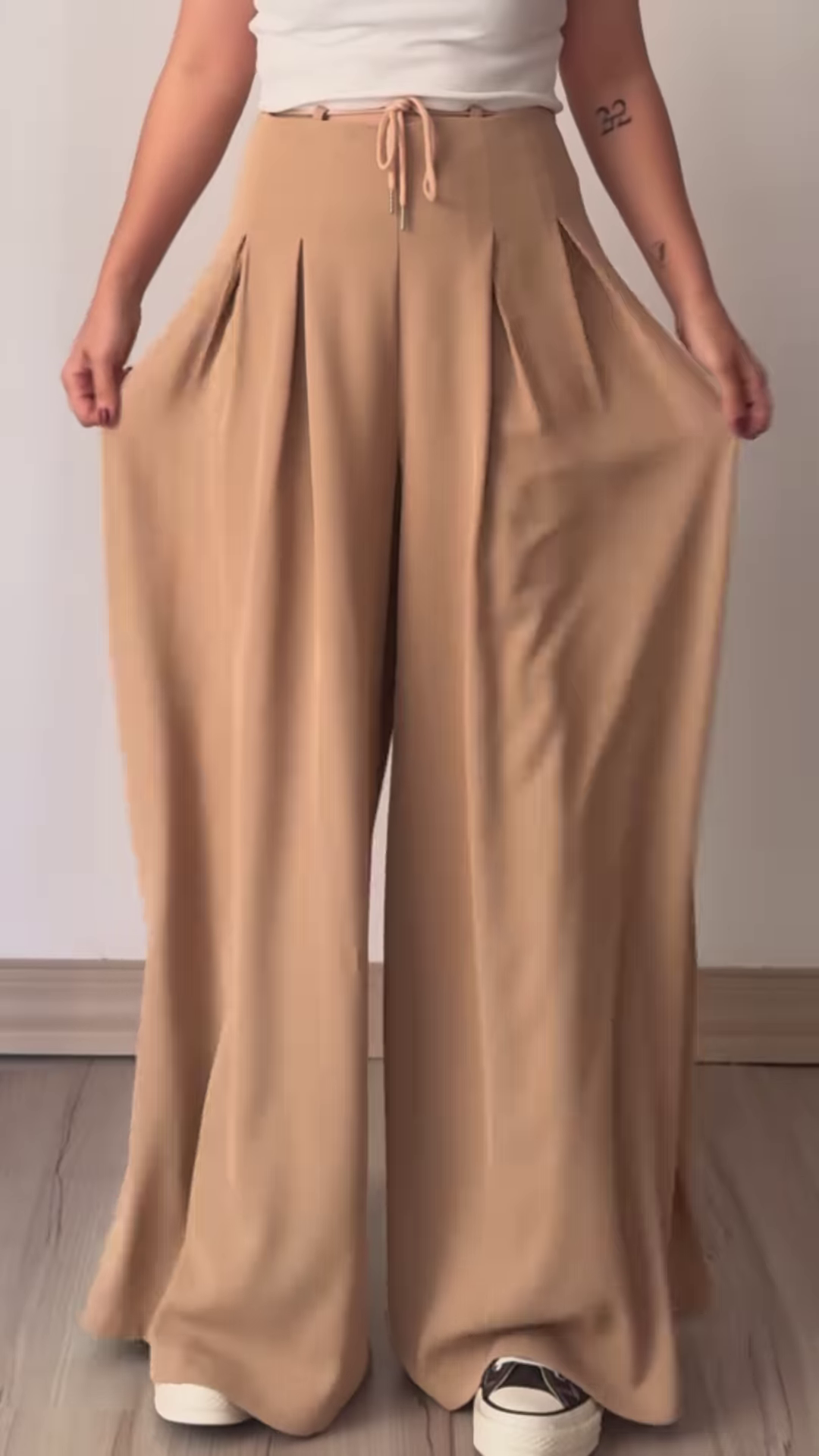 Women’s Beige Wide-Leg Pleated Pants with Drawstring Waist – Flowing Casualwear Styled with White Sneakers - Image 5