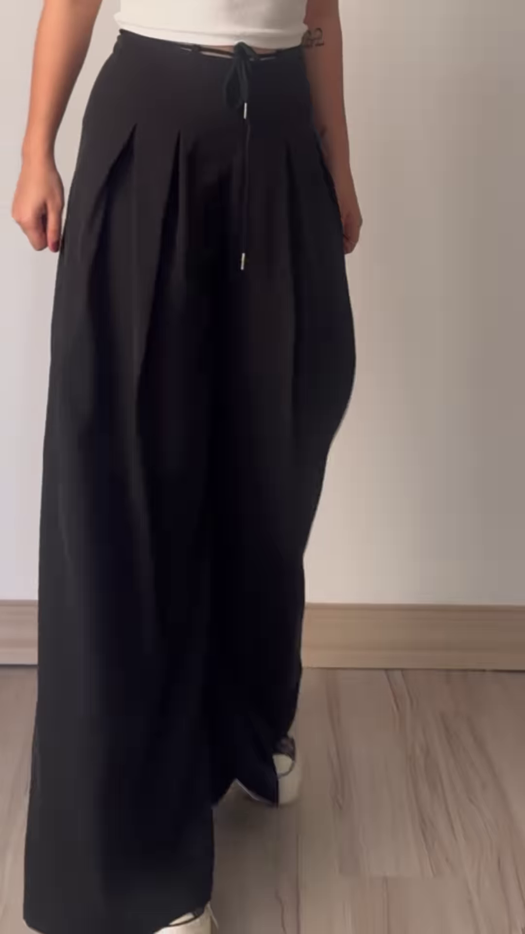 Women’s Beige Wide-Leg Pleated Pants with Drawstring Waist – Flowing Casualwear Styled with White Sneakers - Image 2