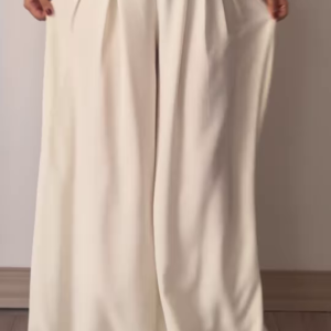 Women’s Beige Wide-Leg Pleated Pants with Drawstring Waist – Flowing Casualwear Styled with White Sneakers